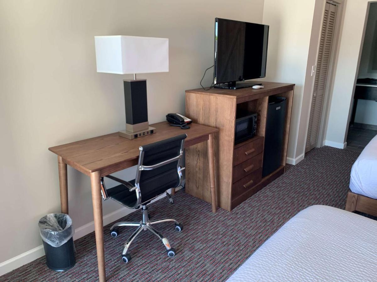 Two Double Beds, Chair with Ottoman and Desk