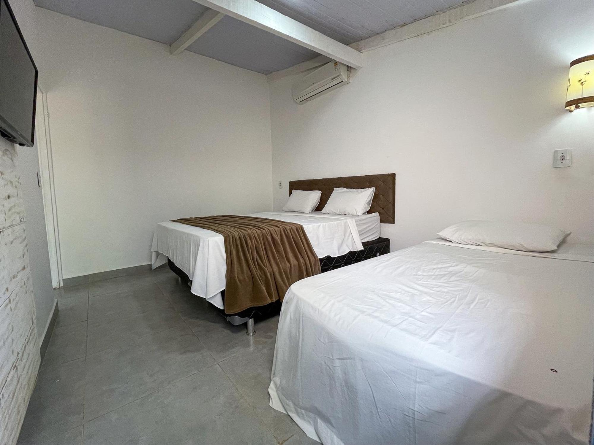 Quarto Triplo com Banheira
