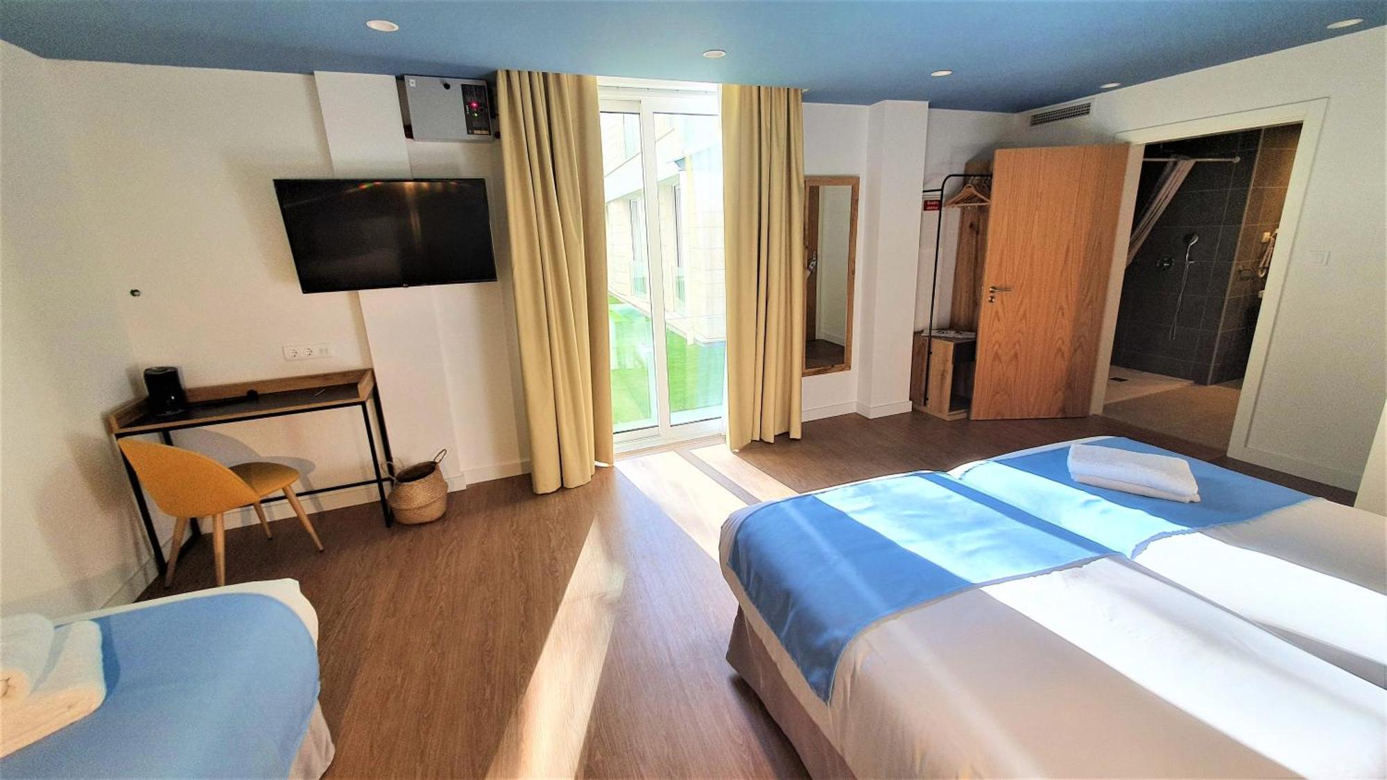 Habitación Triple con vistas al jardín