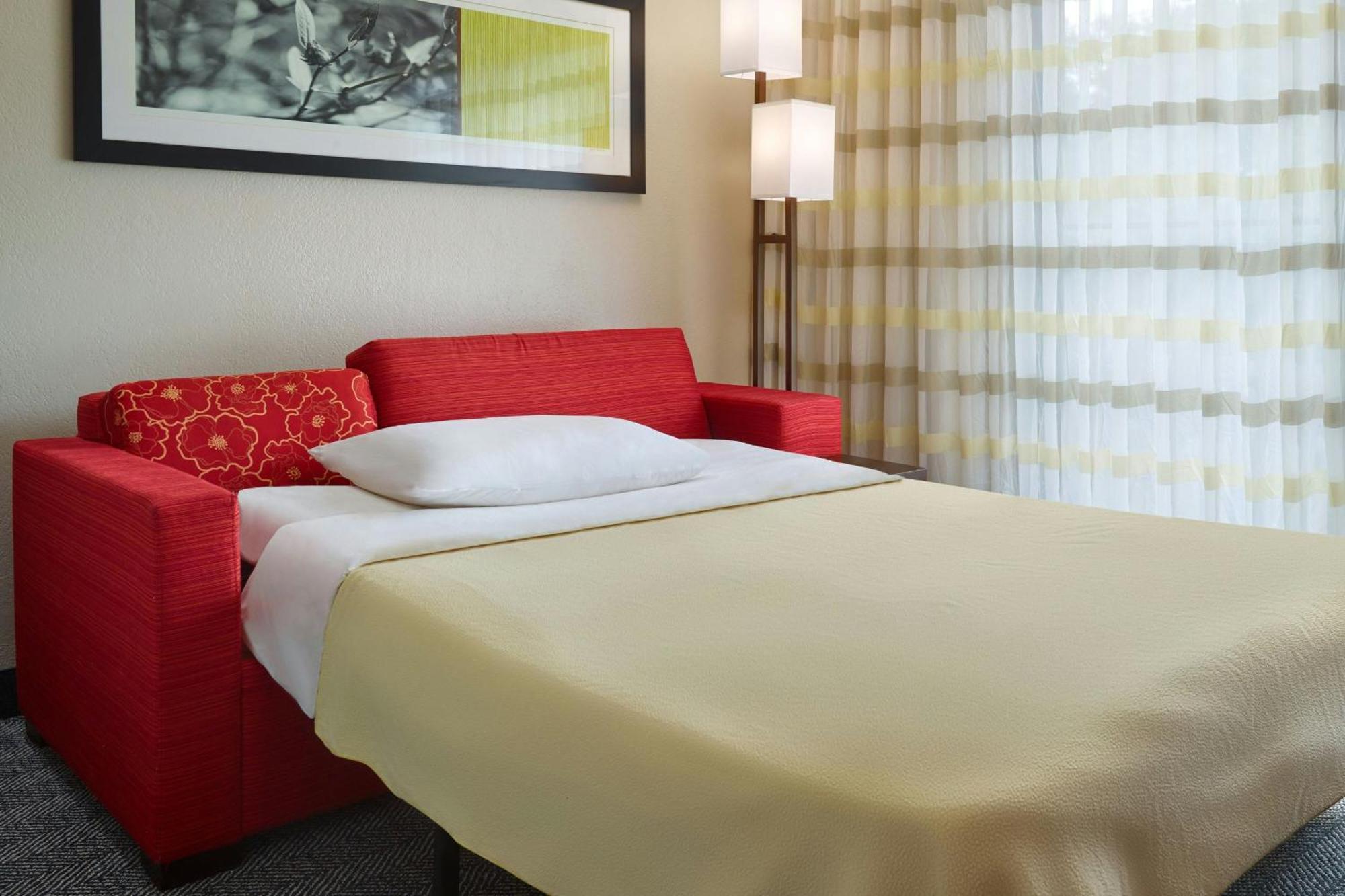King Room with Sofa Bed and Courtyard View