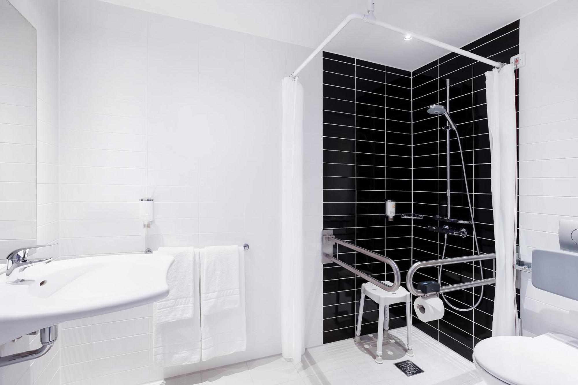 Queen Room Mobility Access Roll Shower or Non-Smoking