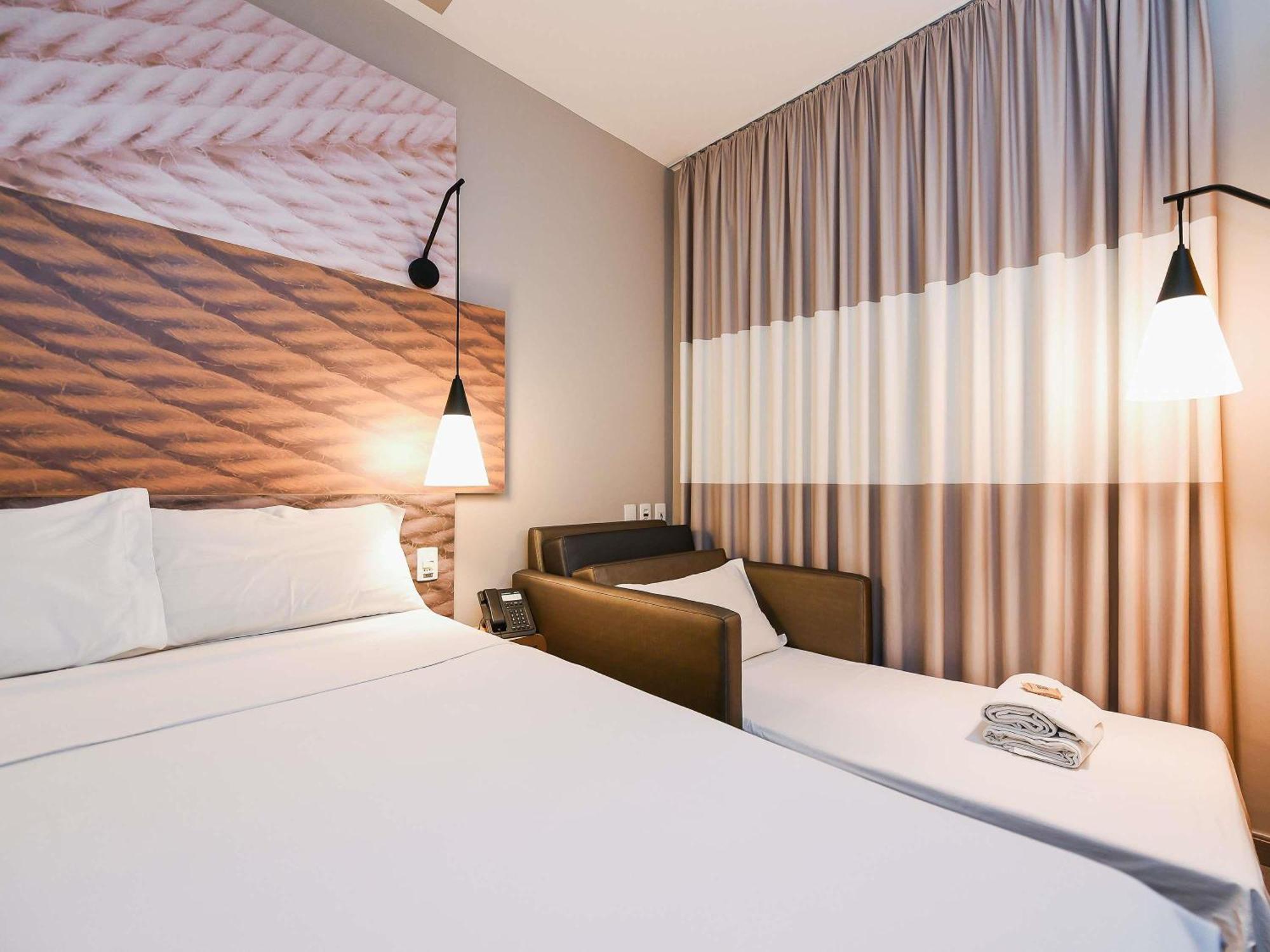 Standard Room with double bed and sofa
