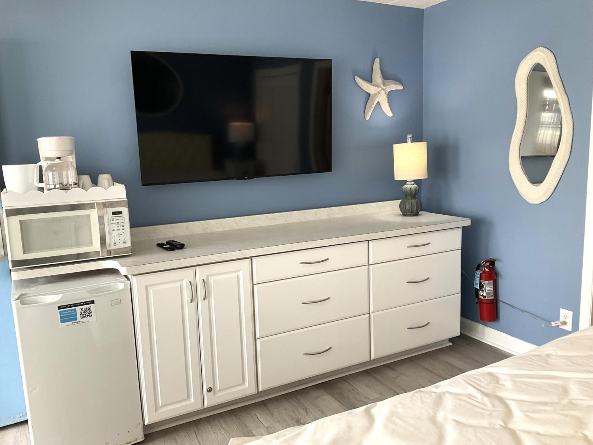 Poolside motel room with a king bed
