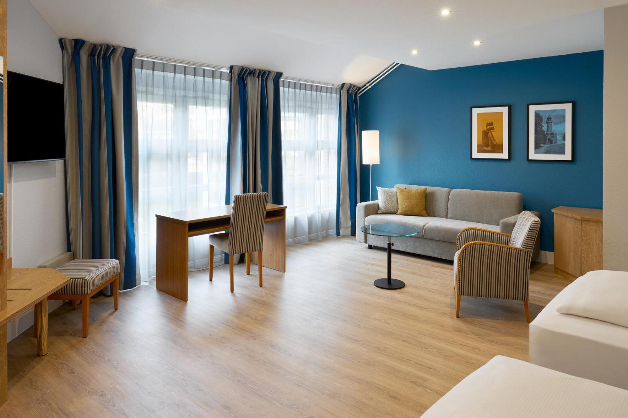 Standard Family Room Two Single Beds Sofa Bed