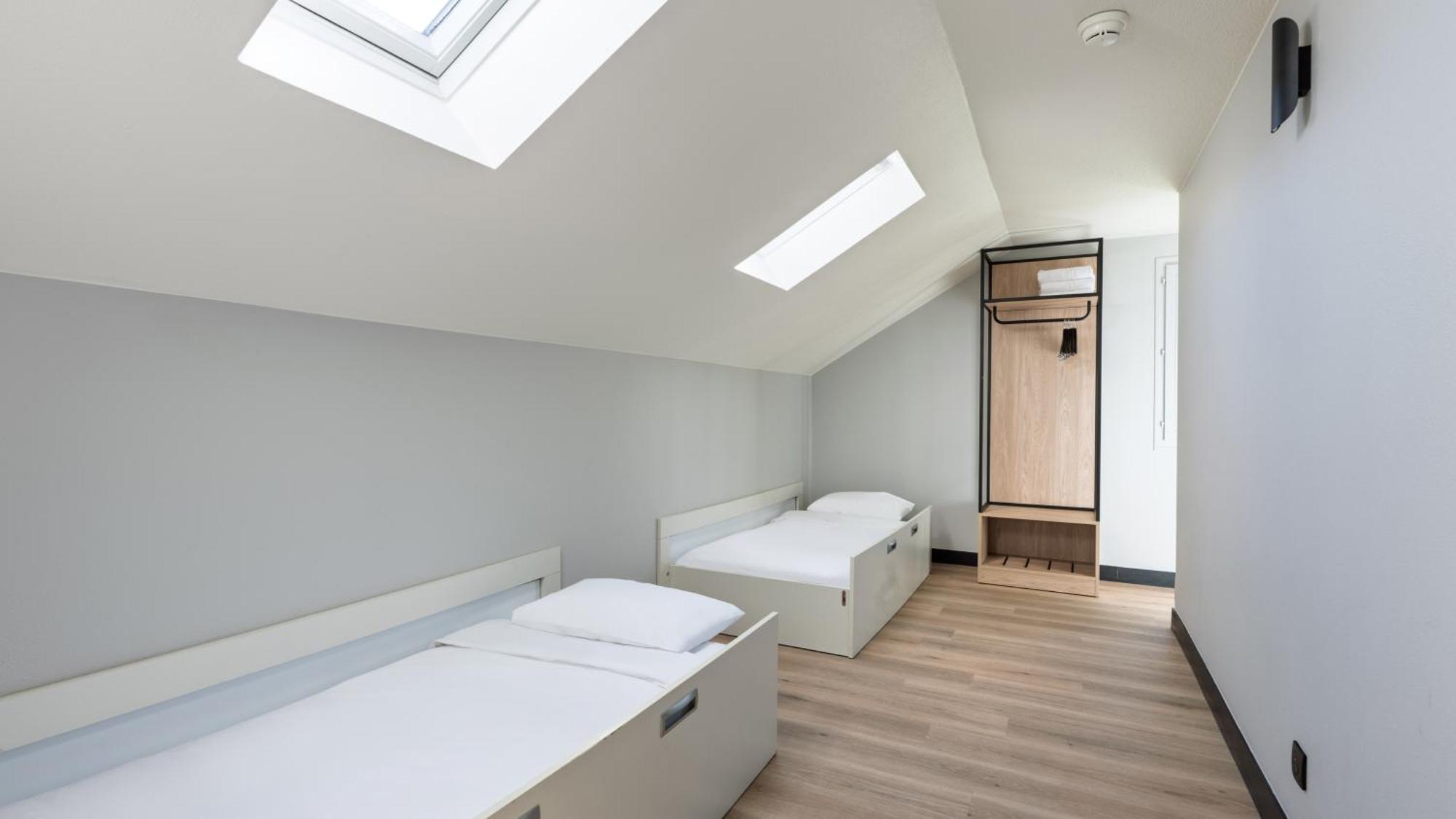 Standard Queen Room One Queen Bed Three Single Beds