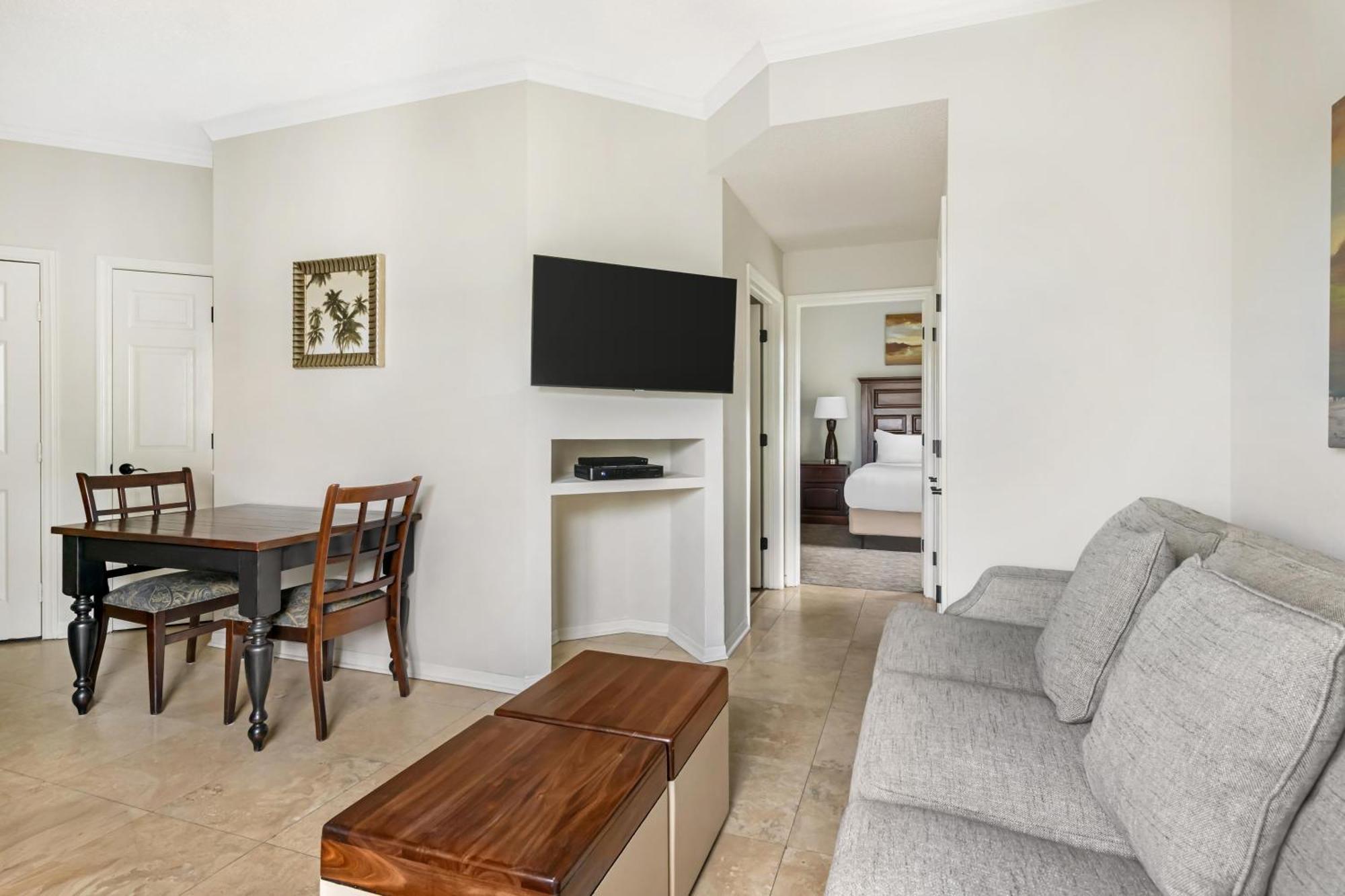 Two-Bedroom Deluxe Suite with One King Bed, Two Double Beds and Balcony