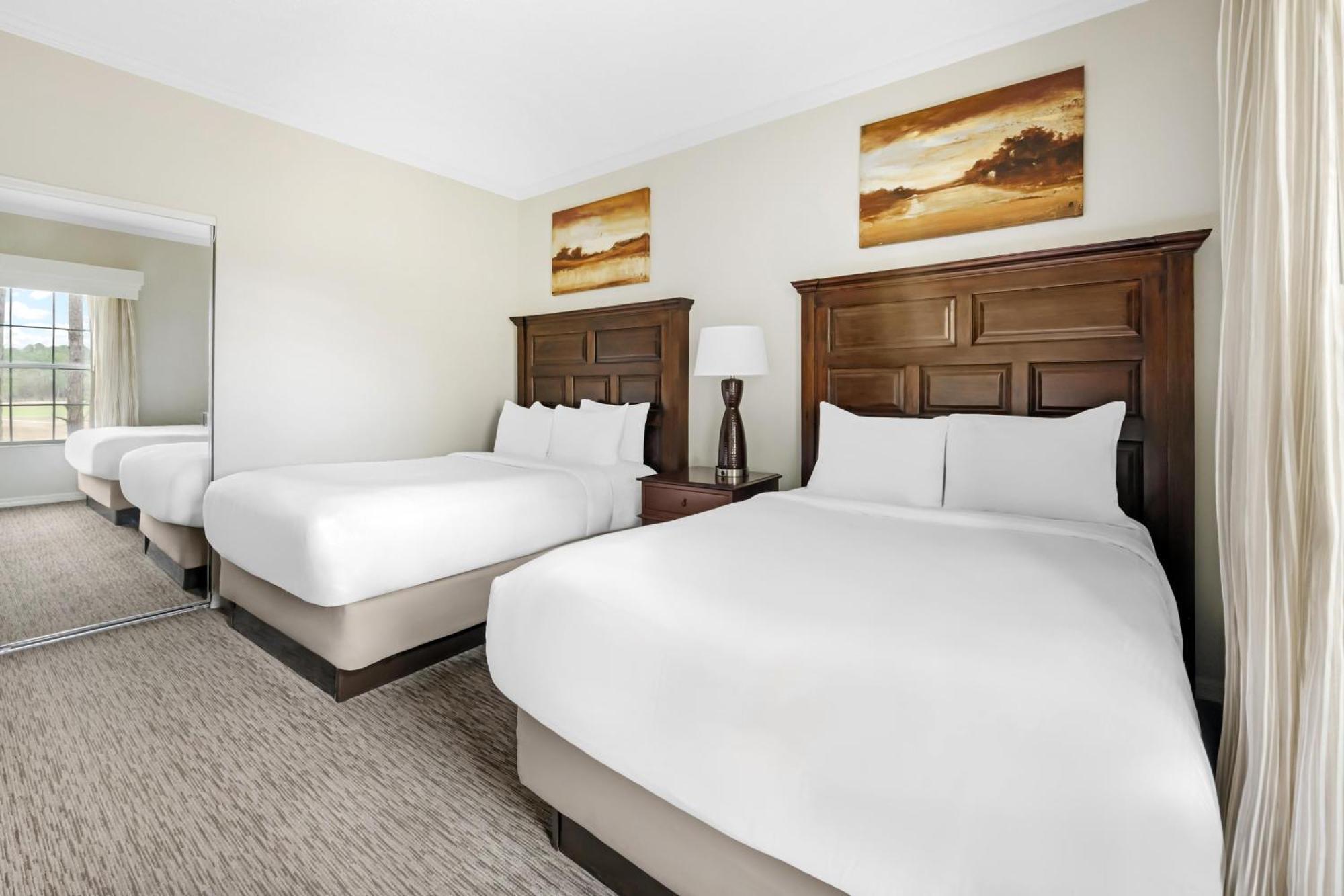 Two-Bedroom Deluxe Suite One King Bed Two Double Beds Balcony