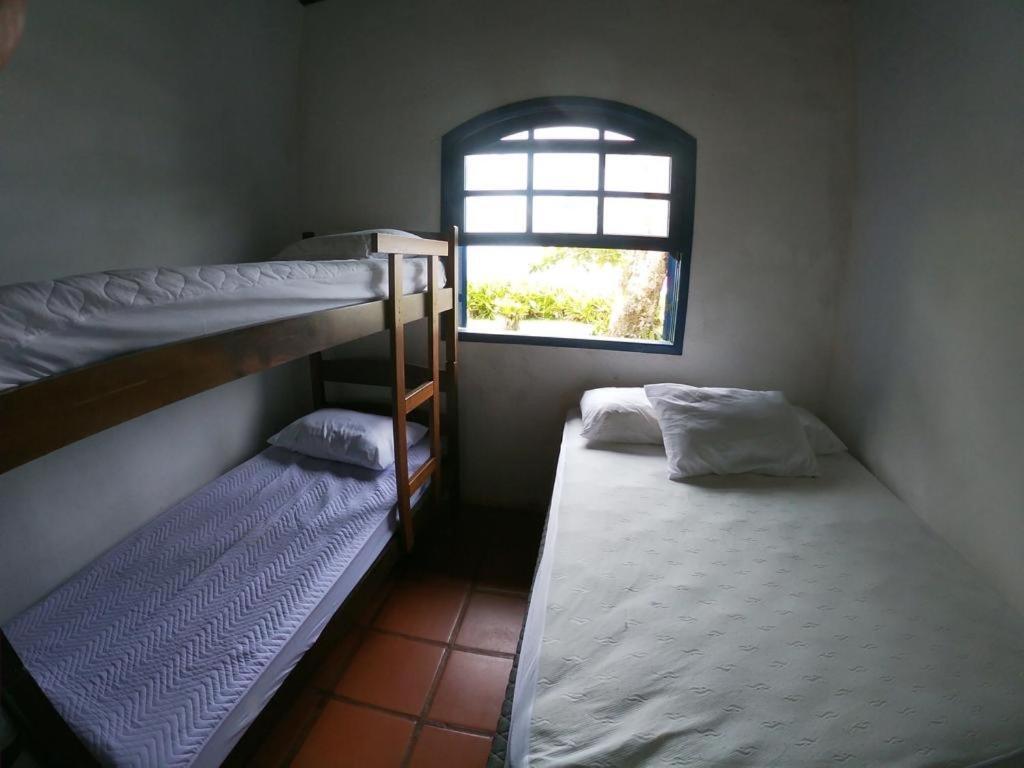 Quarto Quádruplo com Vista do Mar.